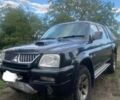 Чорний Міцубісі Л 200, об'ємом двигуна 2.5 л та пробігом 198 тис. км за 5300 $, фото 1 на Automoto.ua
