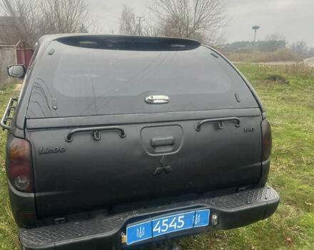 Черный Мицубиси Л 200, объемом двигателя 2.5 л и пробегом 287 тыс. км за 9000 $, фото 2 на Automoto.ua