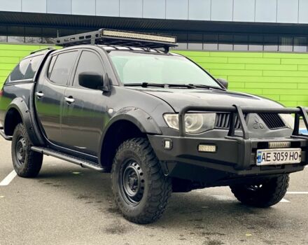 Черный Мицубиси Л 200, объемом двигателя 2.5 л и пробегом 185 тыс. км за 13500 $, фото 1 на Automoto.ua