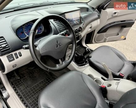 Черный Мицубиси Л 200, объемом двигателя 2.48 л и пробегом 232 тыс. км за 13900 $, фото 59 на Automoto.ua
