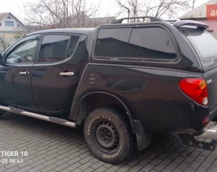 Чорний Міцубісі Л 200, об'ємом двигуна 2.48 л та пробігом 198 тис. км за 11500 $, фото 1 на Automoto.ua