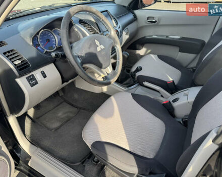 Мицубиси Л 200 2007 в Киеве на Automoto.ua Черный Мицубиси Л 200, объемом двигателя 2.48 л и пробегом 283 тыс. км за 10999 $, фото 21 на Automoto.ua