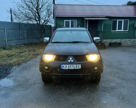 Черный Мицубиси Л 200, объемом двигателя 2.5 л и пробегом 199 тыс. км за 11800 $, фото 1 на Automoto.ua