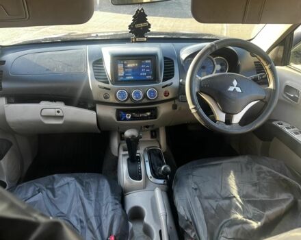 Черный Мицубиси Л 200, объемом двигателя 2 л и пробегом 209 тыс. км за 5803 $, фото 5 на Automoto.ua