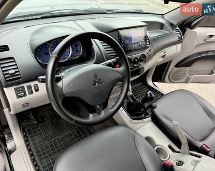 Черный Мицубиси Л 200, объемом двигателя 2.48 л и пробегом 232 тыс. км за 13900 $, фото 60 на Automoto.ua