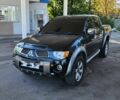 Чорний Міцубісі Л 200, об'ємом двигуна 2.5 л та пробігом 230 тис. км за 5850 $, фото 1 на Automoto.ua