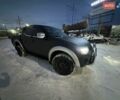 Черный Мицубиси Л 200, объемом двигателя 2.48 л и пробегом 235 тыс. км за 12500 $, фото 1 на Automoto.ua