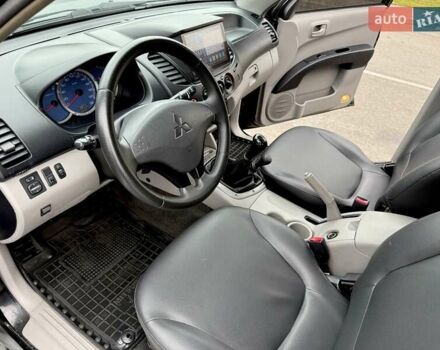 Черный Мицубиси Л 200, объемом двигателя 2.48 л и пробегом 232 тыс. км за 13900 $, фото 58 на Automoto.ua