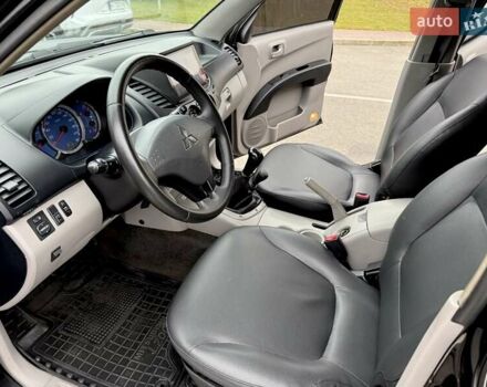 Черный Мицубиси Л 200, объемом двигателя 2.48 л и пробегом 232 тыс. км за 13900 $, фото 57 на Automoto.ua