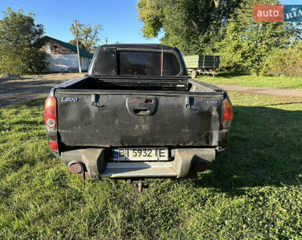 Черный Мицубиси Л 200, объемом двигателя 2.48 л и пробегом 320 тыс. км за 7500 $, фото 5 на Automoto.ua