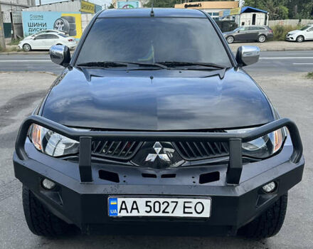 Черный Мицубиси Л 200, объемом двигателя 2.48 л и пробегом 210 тыс. км за 16500 $, фото 1 на Automoto.ua