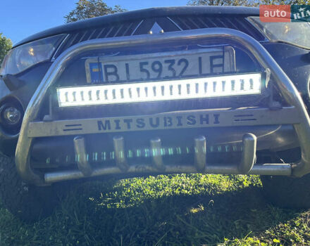 Черный Мицубиси Л 200, объемом двигателя 2.48 л и пробегом 320 тыс. км за 7500 $, фото 10 на Automoto.ua