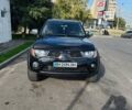 Чорний Міцубісі Л 200, об'ємом двигуна 2.5 л та пробігом 234 тис. км за 12500 $, фото 1 на Automoto.ua