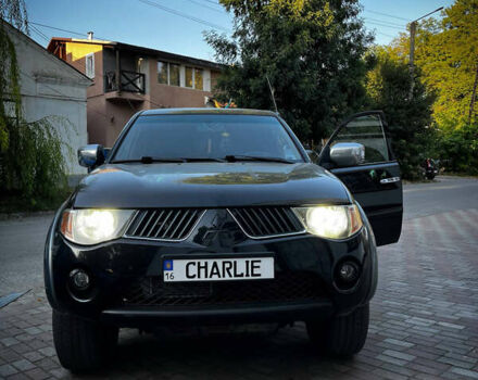 Черный Мицубиси Л 200, объемом двигателя 2.5 л и пробегом 221 тыс. км за 12800 $, фото 3 на Automoto.ua