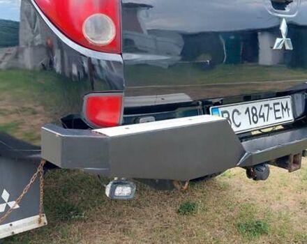 Черный Мицубиси Л 200, объемом двигателя 2.48 л и пробегом 392 тыс. км за 15500 $, фото 2 на Automoto.ua