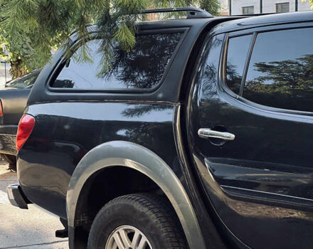 Черный Мицубиси Л 200, объемом двигателя 2.5 л и пробегом 221 тыс. км за 12800 $, фото 1 на Automoto.ua