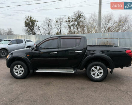 Черный Мицубиси Л 200, объемом двигателя 2.5 л и пробегом 261 тыс. км за 12300 $, фото 20 на Automoto.ua