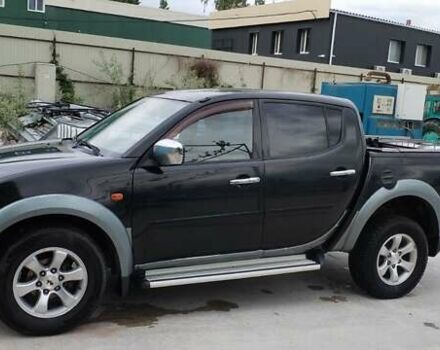 Черный Мицубиси Л 200, объемом двигателя 2.48 л и пробегом 291 тыс. км за 11000 $, фото 6 на Automoto.ua