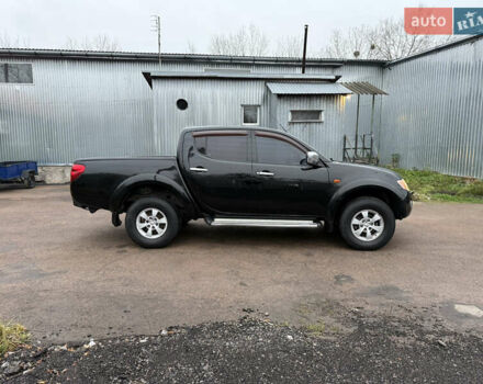 Черный Мицубиси Л 200, объемом двигателя 2.5 л и пробегом 261 тыс. км за 12300 $, фото 11 на Automoto.ua