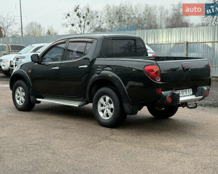 Черный Мицубиси Л 200, объемом двигателя 2.5 л и пробегом 261 тыс. км за 12300 $, фото 1 на Automoto.ua