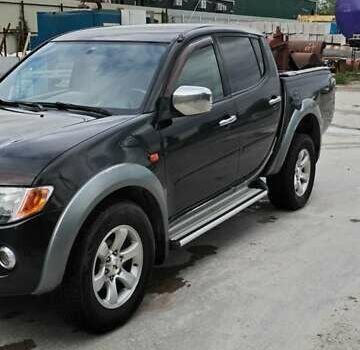 Черный Мицубиси Л 200, объемом двигателя 2.48 л и пробегом 291 тыс. км за 11000 $, фото 7 на Automoto.ua