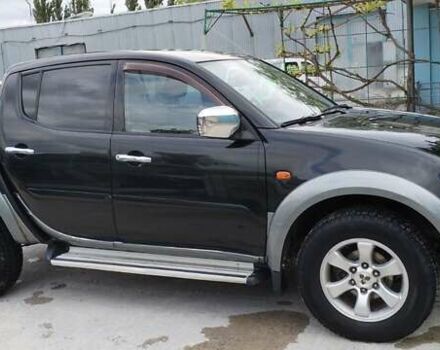 Черный Мицубиси Л 200, объемом двигателя 2.48 л и пробегом 291 тыс. км за 11000 $, фото 4 на Automoto.ua