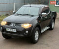 Черный Мицубиси Л 200, объемом двигателя 2.5 л и пробегом 261 тыс. км за 12300 $, фото 1 на Automoto.ua