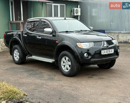 Черный Мицубиси Л 200, объемом двигателя 2.5 л и пробегом 261 тыс. км за 12300 $, фото 3 на Automoto.ua