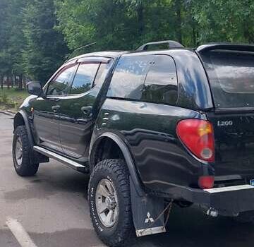 Черный Мицубиси Л 200, объемом двигателя 2.48 л и пробегом 392 тыс. км за 15500 $, фото 25 на Automoto.ua