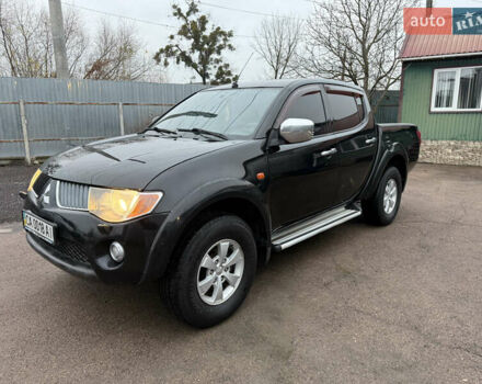 Черный Мицубиси Л 200, объемом двигателя 2.5 л и пробегом 261 тыс. км за 12300 $, фото 10 на Automoto.ua