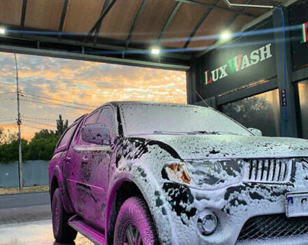 Черный Мицубиси Л 200, объемом двигателя 2.5 л и пробегом 221 тыс. км за 12800 $, фото 2 на Automoto.ua