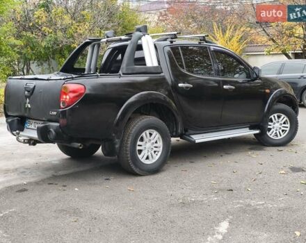 Черный Мицубиси Л 200, объемом двигателя 2.48 л и пробегом 260 тыс. км за 9500 $, фото 9 на Automoto.ua