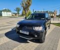 Черный Мицубиси Л 200, объемом двигателя 2.5 л и пробегом 140 тыс. км за 7298 $, фото 5 на Automoto.ua