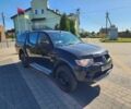 Черный Мицубиси Л 200, объемом двигателя 2.5 л и пробегом 140 тыс. км за 7298 $, фото 1 на Automoto.ua