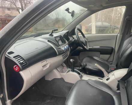 Черный Мицубиси Л 200, объемом двигателя 2.5 л и пробегом 145 тыс. км за 6800 $, фото 18 на Automoto.ua