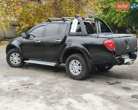 Черный Мицубиси Л 200, объемом двигателя 2.48 л и пробегом 260 тыс. км за 9500 $, фото 1 на Automoto.ua