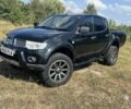 Черный Мицубиси Л 200, объемом двигателя 2.5 л и пробегом 152 тыс. км за 8101 $, фото 2 на Automoto.ua