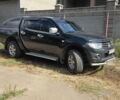 Чорний Міцубісі Л 200, об'ємом двигуна 2.5 л та пробігом 240 тис. км за 16699 $, фото 1 на Automoto.ua