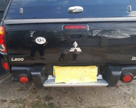 Черный Мицубиси Л 200, объемом двигателя 2.48 л и пробегом 108 тыс. км за 17500 $, фото 1 на Automoto.ua