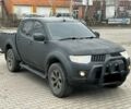 Чорний Міцубісі Л 200, об'ємом двигуна 2.5 л та пробігом 128 тис. км за 5650 $, фото 1 на Automoto.ua