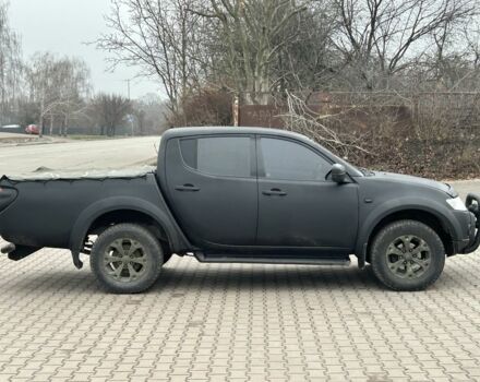 Чорний Міцубісі Л 200, об'ємом двигуна 2.5 л та пробігом 128 тис. км за 5650 $, фото 1 на Automoto.ua