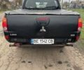 Черный Мицубиси Л 200, объемом двигателя 2.48 л и пробегом 295 тыс. км за 14800 $, фото 1 на Automoto.ua