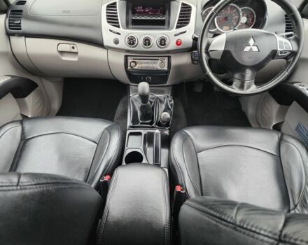 Черный Мицубиси Л 200, объемом двигателя 2.5 л и пробегом 114 тыс. км за 8748 $, фото 21 на Automoto.ua