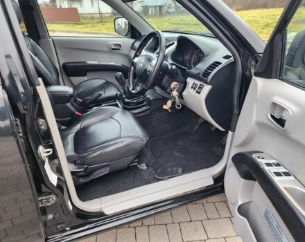 Черный Мицубиси Л 200, объемом двигателя 2.5 л и пробегом 114 тыс. км за 8748 $, фото 13 на Automoto.ua