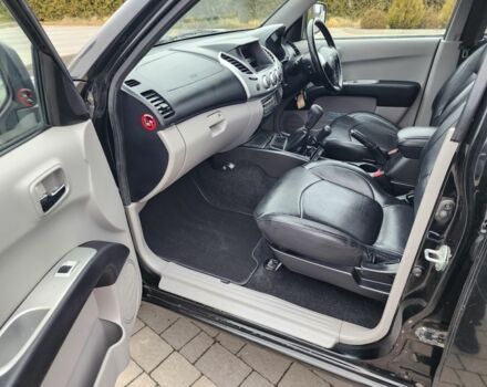 Черный Мицубиси Л 200, объемом двигателя 2.5 л и пробегом 114 тыс. км за 8748 $, фото 17 на Automoto.ua