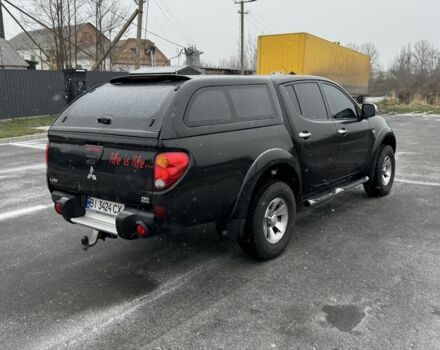 Черный Мицубиси Л 200, объемом двигателя 2.5 л и пробегом 270 тыс. км за 16500 $, фото 2 на Automoto.ua