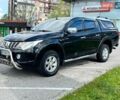 Черный Мицубиси Л 200, объемом двигателя 2.44 л и пробегом 248 тыс. км за 21500 $, фото 1 на Automoto.ua