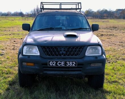 Черный Мицубиси Л 200, объемом двигателя 2.5 л и пробегом 200 тыс. км за 4000 $, фото 1 на Automoto.ua