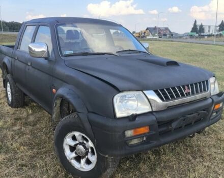 Черный Мицубиси Л 200, объемом двигателя 0 л и пробегом 310 тыс. км за 1802 $, фото 1 на Automoto.ua