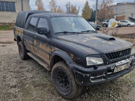 Мицубиси Л 200 2001 в Киеве на Automoto.ua Черный Мицубиси Л 200, объемом двигателя 2.5 л и пробегом 288 тыс. км за 5844 $, фото 1 на Automoto.ua